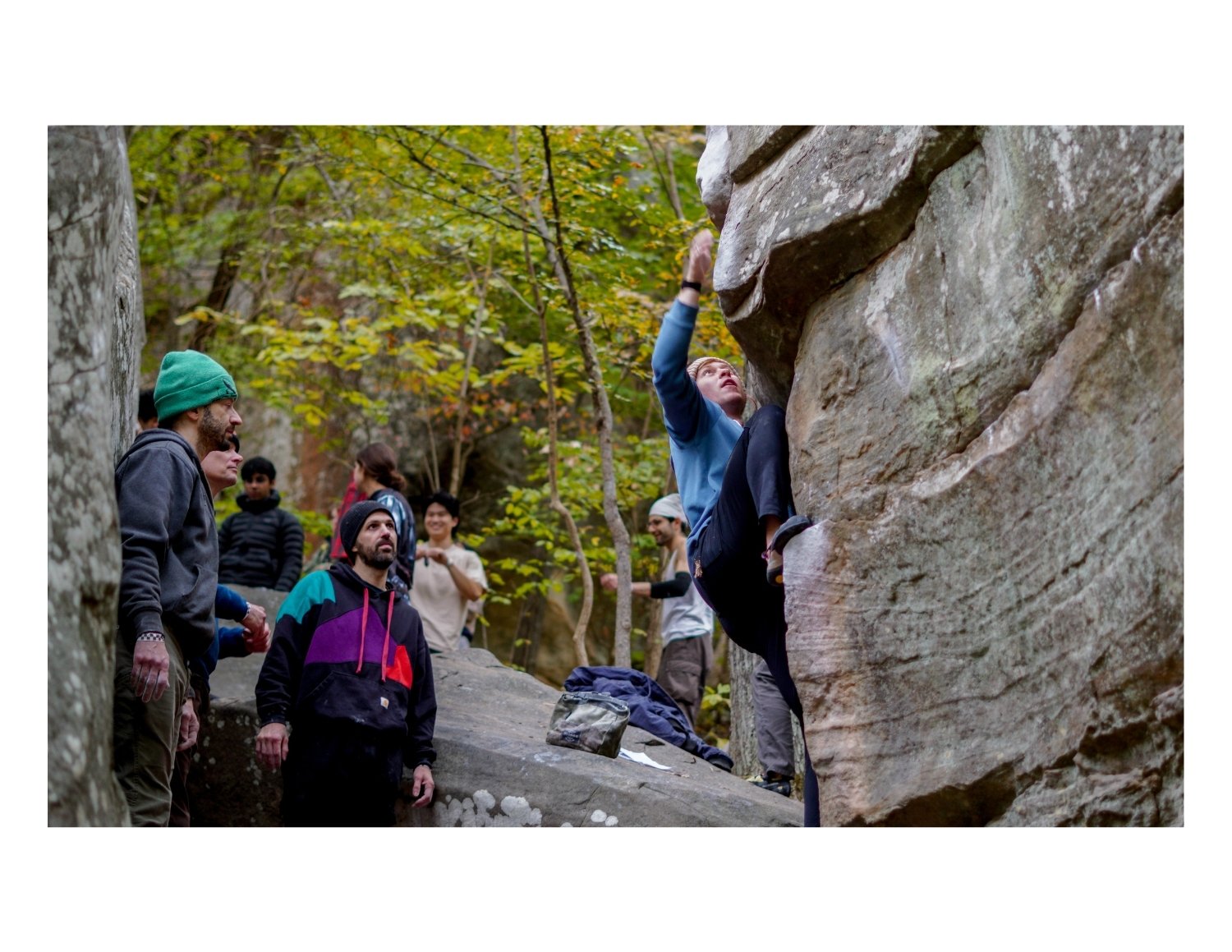 Candid portrait of woman bouldering at Holy Boulders Climbing Competition