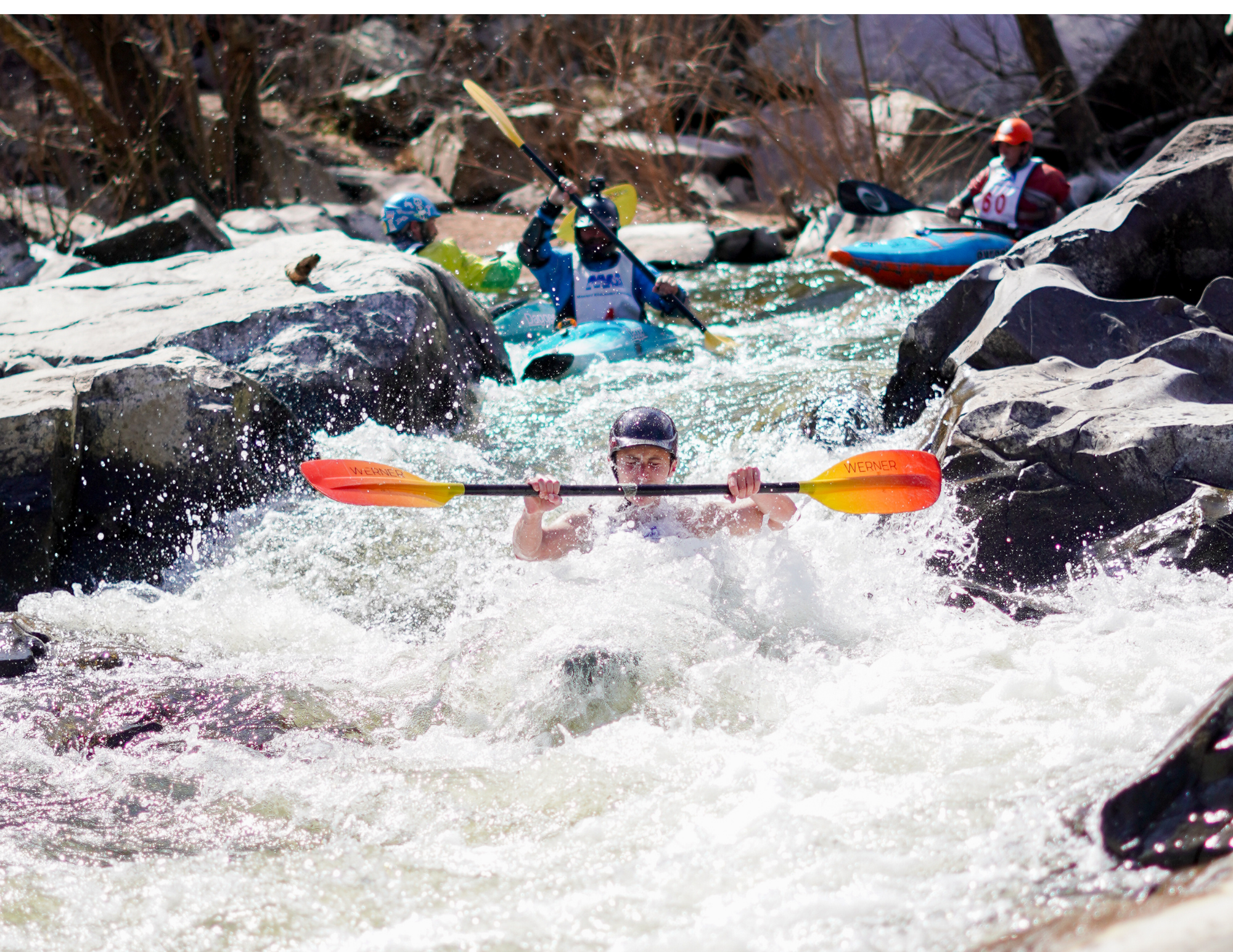 candid action shot of whitewater kayaker on the Saint Francois River during the MO whitewater state championships